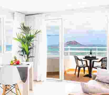 Immerse yourself in a captivating blend of stunning vistas, pristine shorelines, and a serene coastal ambiance in the best apartments in Corralejo